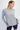 woman wearing the heather grey Super Soft Viscose Long Sleeve Top with shorts on a white background